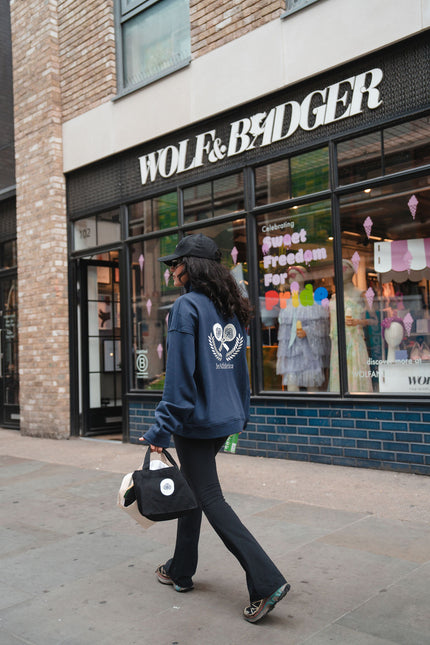 Girl Walking On Street In Navy Zip-Up Sweatshirt