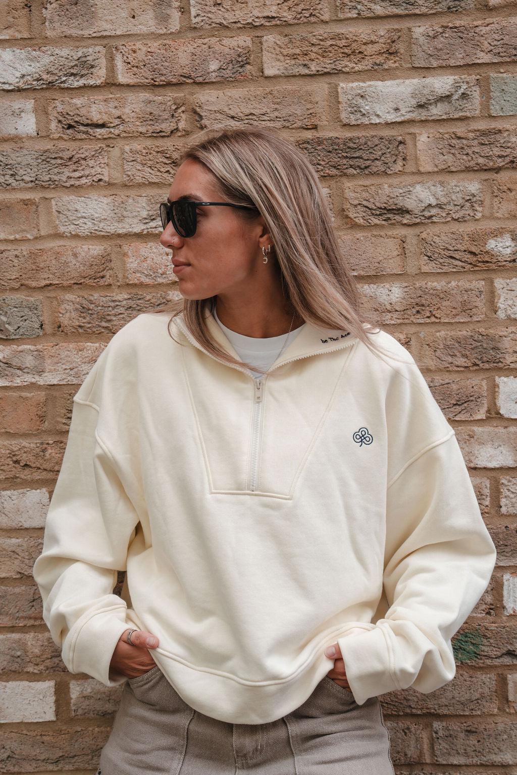 Girl Wearing White Quarter Zip Sweatshirt