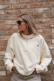 Girl Wearing White Quarter Zip Sweatshirt