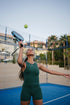Be 180 Racer Tank - Forest | Girl Hitting Ball on Padel Court in Green Racer Tank