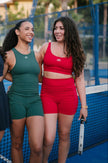 Girl in Be Athletica Red Sports Bra on Padel Court